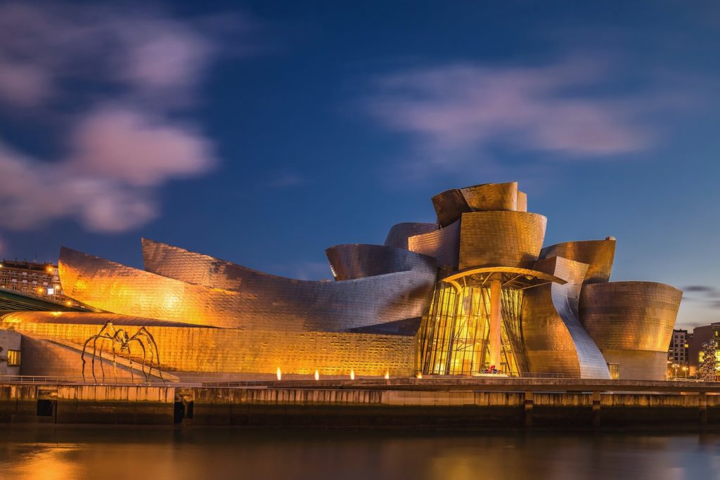 A picture of the striking Guggenheim Museum lit up at night from a holiday in Spain