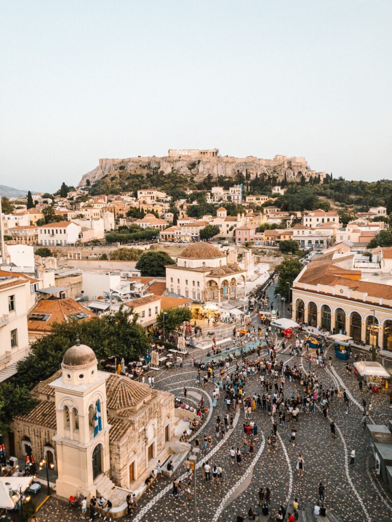 The cobbled streets of Monastiraki, one of the oldest neighbourhoods in Athens, with the Acropolis in the background.