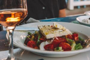 authentic greek salad made with tomatoes, feta, salad and olive oil