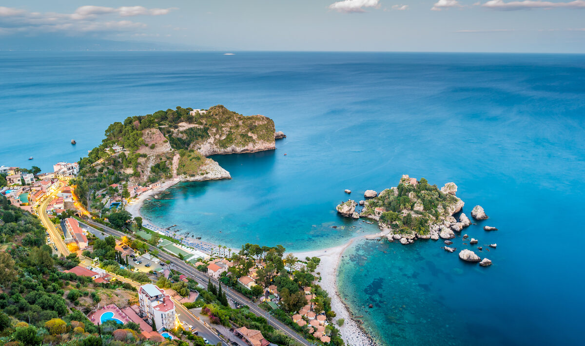 Beautiful landscape of Taormina, Italy. Sicilian seascape with beach and island Isola Bella.